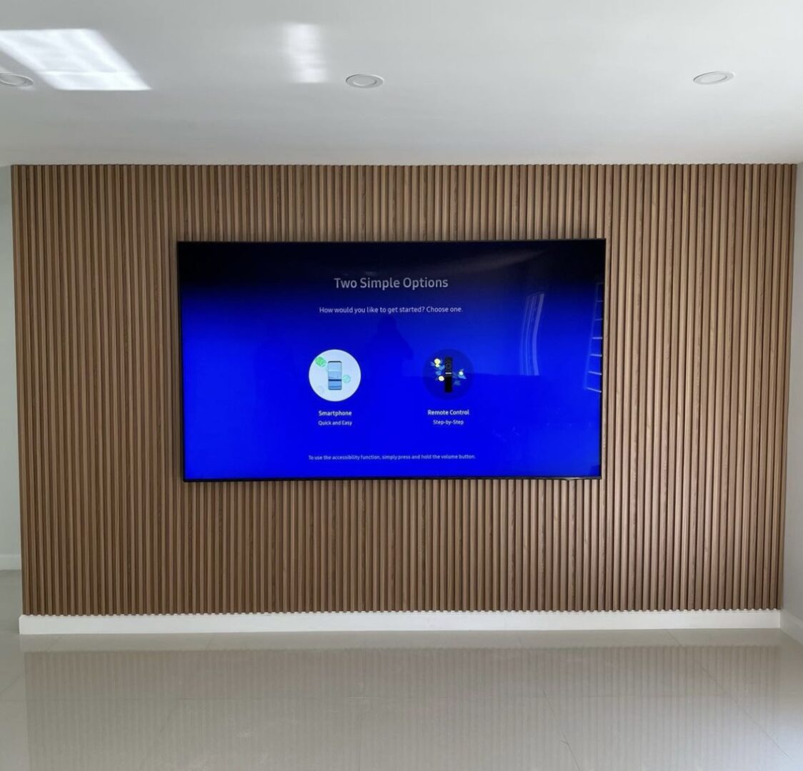 A large flat screen tv mounted to the wall.