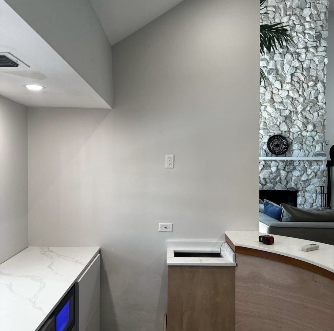 A bathroom with a tv and sink in it