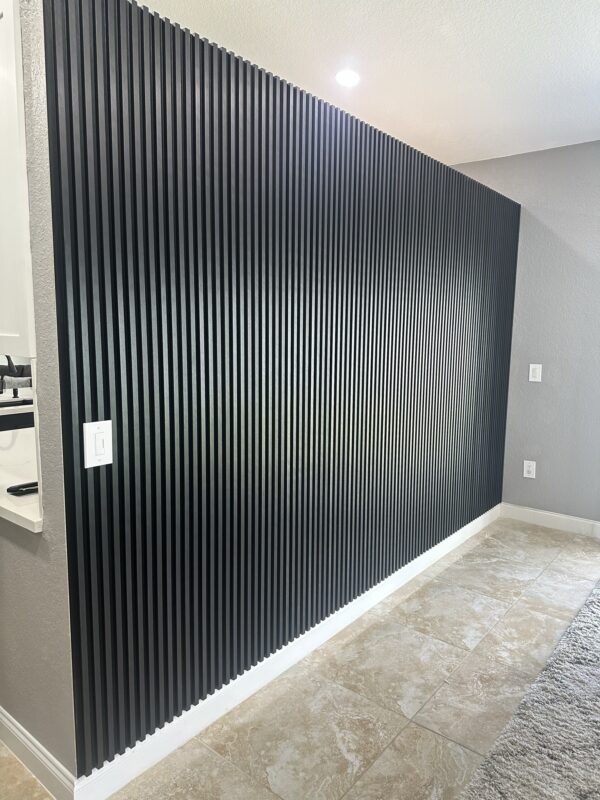 A black wall with some white lines on it